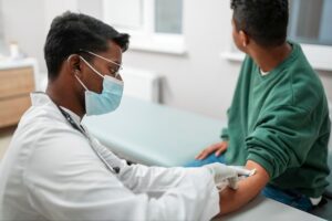 A nurse educating a patient on importance of vaccination 