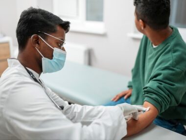 A nurse educating a patient on importance of vaccination