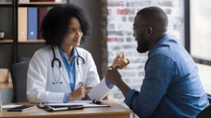 a doctor teaching a patient how to get health insurance