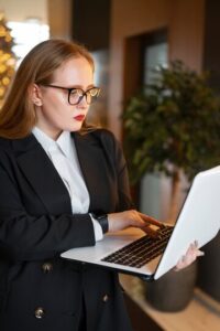 a business woman checking out the key benefits of cyber insurance 